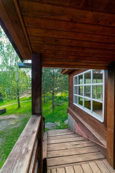 Wooden house in the forest. Individual construction of cottages.