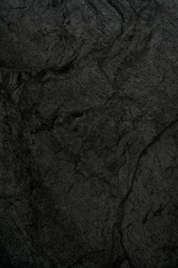 Siyah kaba taşın dokusu. Soyut koyu arkaplan. 