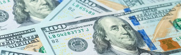 Background of one hundred dollar bills. Benjamin Franklin on USA money banknote