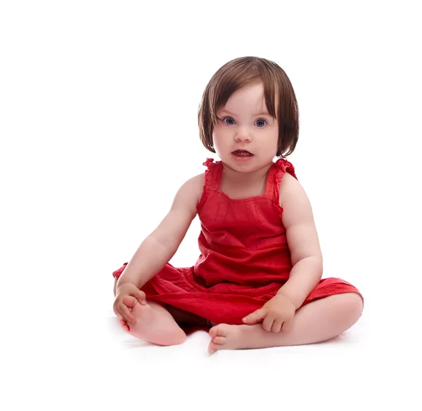 Kırmızı elbiseli kız bebek — Stok fotoğraf