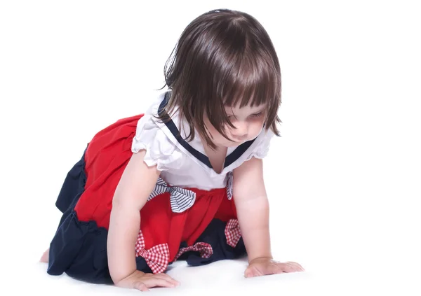 Bambina in un vestito isolato su uno sfondo bianco — Foto Stock