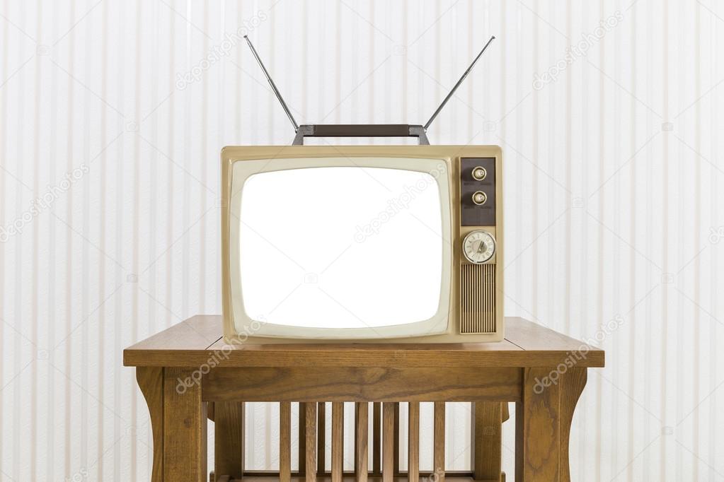 Old Television with Antenna on Wood Table with Cut Out Screen