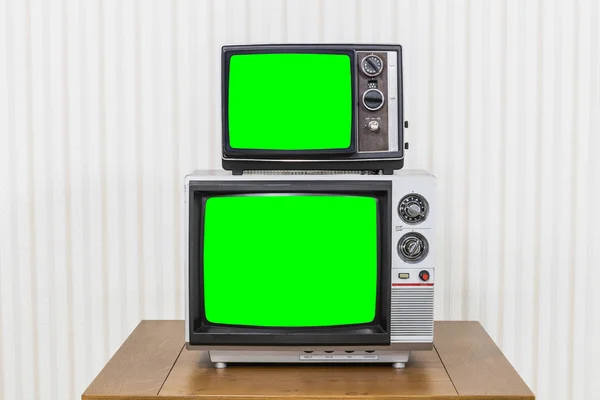 Vintage-TV-Stack mit Chroma-Schlüssel grünen Bildschirmen — Stockfoto