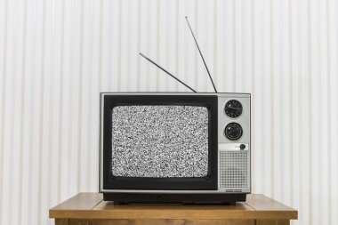 Old Television On Wood Table With Static Screen