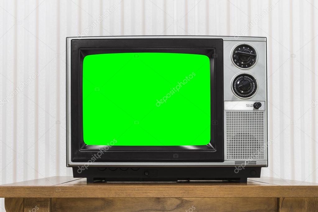 Old Portable Television on Wood Table with Chroma Key Green Scre