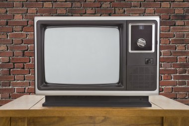 Eski televizyon ve tuğla duvar tablo