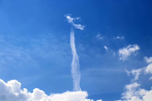 A cloud in the sky looks like a figure flying high