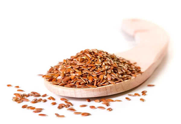 Brown flax seeds in wooden spoon — Stock Photo, Image