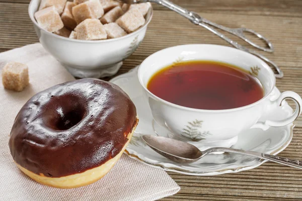 Chocolate donut with hot tea — Stock Photo, Image