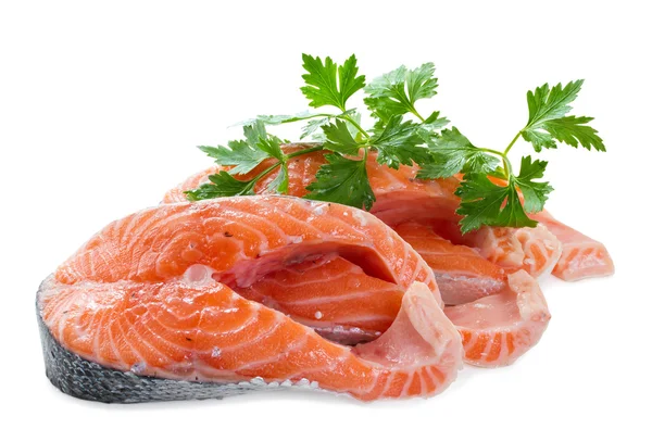 Two pieces of salmon fillet with a sprig of parsley on a white b — Stock Photo, Image