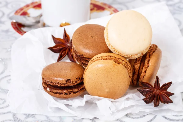 Chocolate macaroons with anise stars — Stock Photo, Image