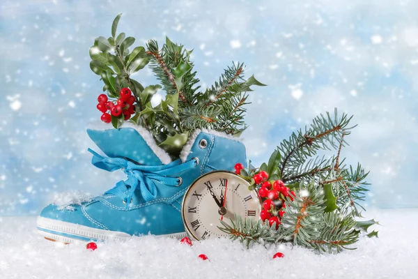 Christmas clock with boots and Holly leaves — Stock Photo, Image