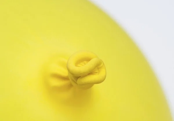 Yellow balloon knot — Stock Photo, Image