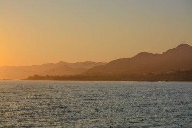 Sunset over Pismo Beach on the Pacific Ocean in San Luis Obispo County, California clipart
