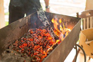 Place for a barbeque is ready. Firewood and charcoal.