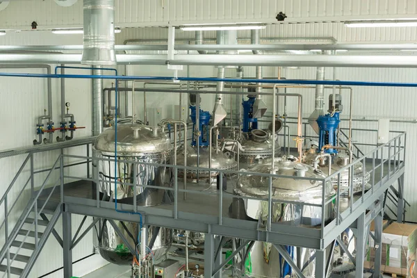 Tanks for chemical mixing on chemical plant. Concept: Manufacturing