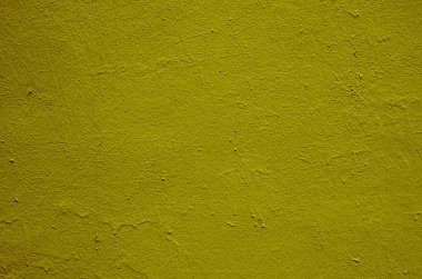 Hardal boyasıyla boyanmış sıva dokusu..