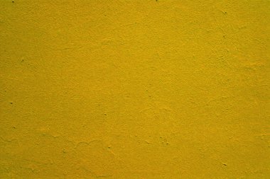 Alçıda doymuş parlak sarı boya dokusu.