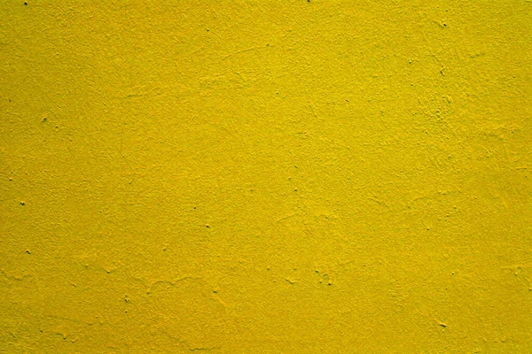 Textura de tinta amarela brilhante velha na parede. — Fotografia de Stock