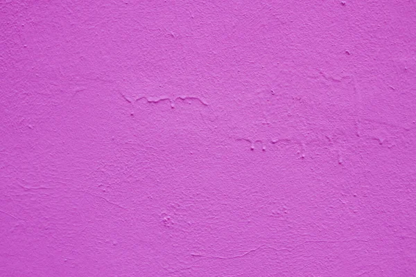 Hermoso estuco texturizado púrpura en la pared. Fotos de stock libres de derechos