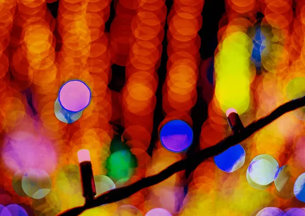 Beautiful close-up bokeh on a blurry background of red lights. — Stock Photo, Image
