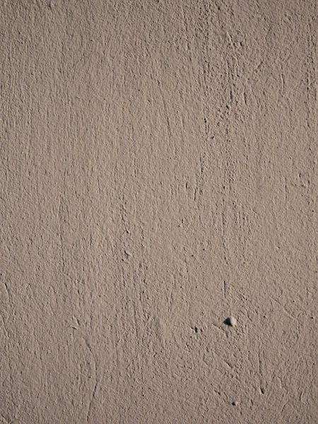 Hrubá textura světle hnědého štuku na stěně. — Stock fotografie