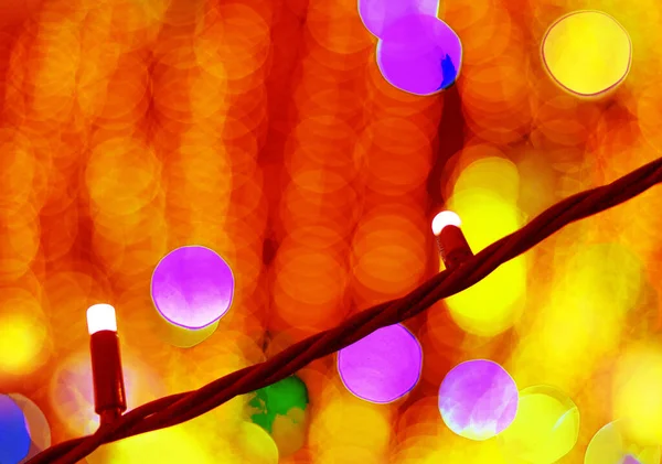 Festive colorful blurry bokeh close-up at night. — Stock Photo, Image