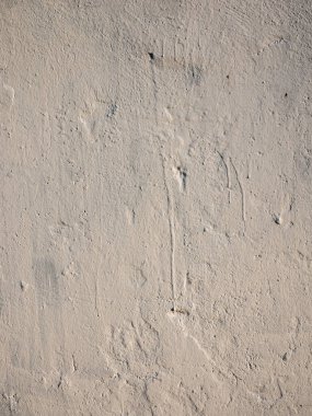 Beautiful brown textured stucco on the wall.