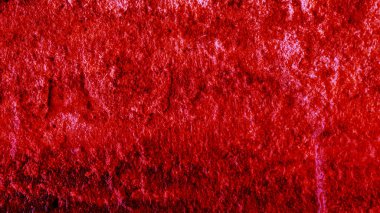 Duvardaki boyadan gelen bulanık kırmızı doku..