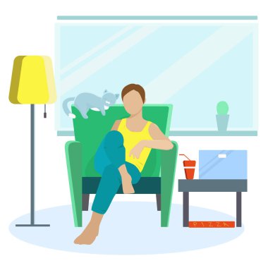 Bir adam bir sandalyede oturuyor ve evde kedisiyle dinleniyor.