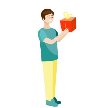 Elinde bir hediye olan bir çocuk gülümsüyor..