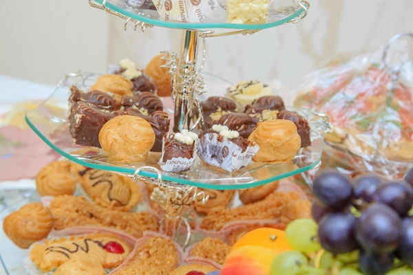 Pallets with various tasty snack — Stock Photo, Image