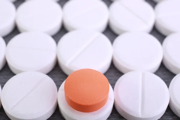 Red and white pill capsules pile — Stock Photo, Image