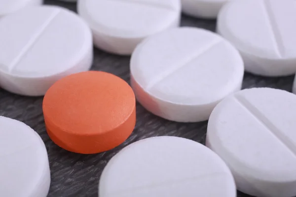 Red and white pill capsules pile — Stock Photo, Image