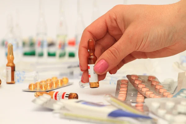 Medical bottles and pills on shelf — Stock Photo, Image