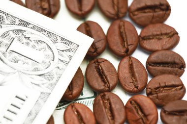 One hundred dollar bill made of coffee beans isolated over white background
