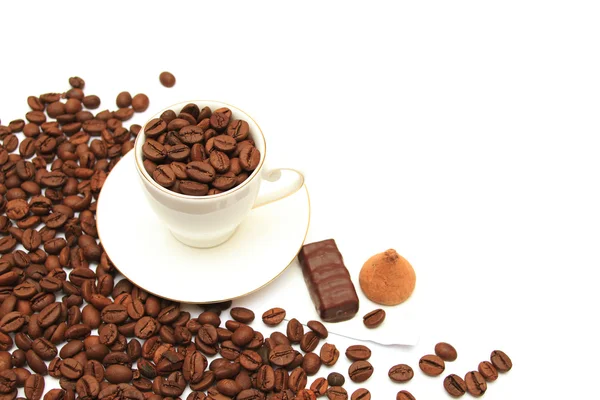 Coffee cup and saucer on a wooden table. Dark background. — Stock Photo, Image