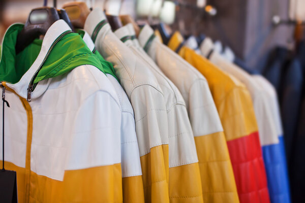 Collection of leather jackets on hangers in the shop