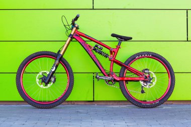 KYIV, UKRAINE - May 22, 2015: Stunt bike stands against red wall background.