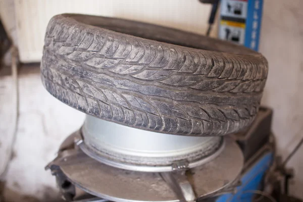 Damaged wheel repairing on the tire — Stock Photo, Image