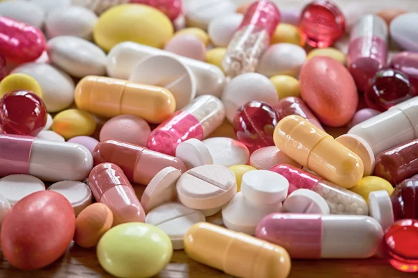 Multicoloured pills and capsules — Stock Photo, Image