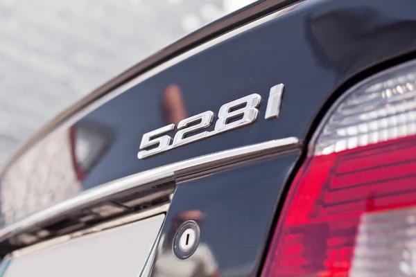 Close-up chome BMW 528i logo