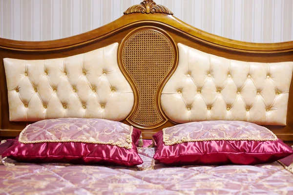 Double bed with decorative headboard — Stock Photo, Image