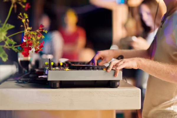 DJ mixing music on console — Stock Photo, Image