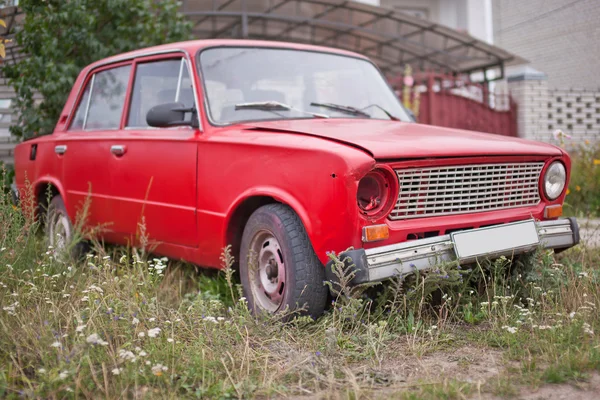 Side view of red old rusty car — Stock Photo, Image