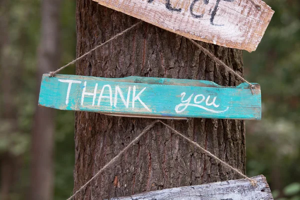 A wooden plaque with the word - thank you — Stock Photo, Image