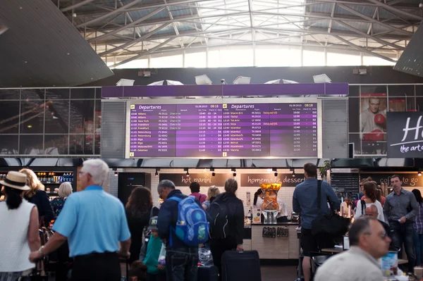 AIRPORT BORISPOL, UKRAINE - SEPTEMBER, 01, 2015: Display information about the departure of the aircraft in Ukrainian airport cafe — стокове фото