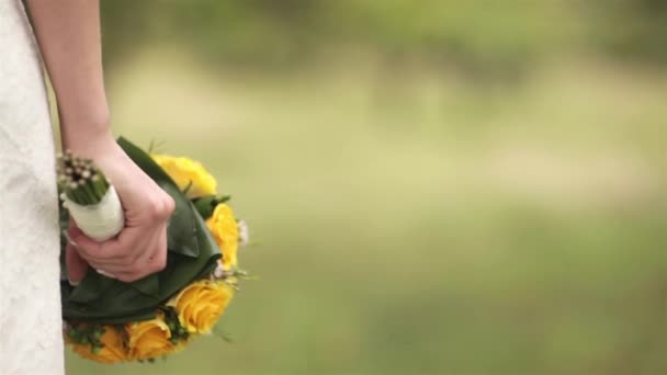 Wedding bouquet in hands of the bride — Stock Video