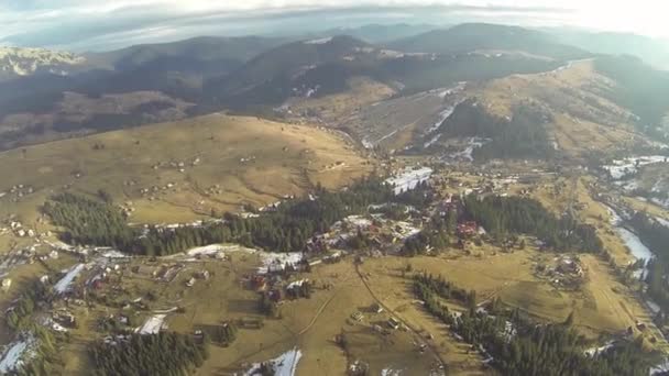 Aerial shot of village in the Carpathian mountains at spring — Stock Video