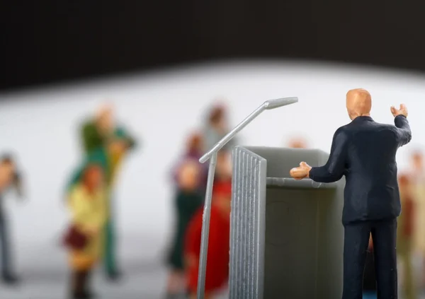 Miniature figurine of a politician speaking to the crowd during an election — Stock Photo, Image